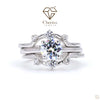 Silver ring with a large central gemstone and smaller diamonds on a white background, featuring the Cheriva Jewels logo.