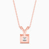 Rose gold necklace with a square-cut diamond pendant on a white background