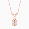 Rose gold necklace with a teardrop-shaped diamond pendant on a white background