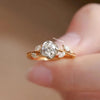 Rose gold ring with a diamond on a blurred background