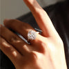 emerald cut diamond ring and cathedral setting.